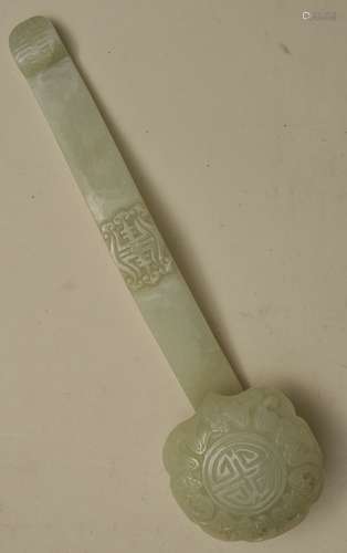 Jade scepter. China. 20th century. Ju-i carved with bats and shou characters. Pale celadon coloured stone. 13-1/4