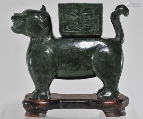 Jade carving. China. 20th century. Deep forest green colour. Carved as a mythical animal. 6
