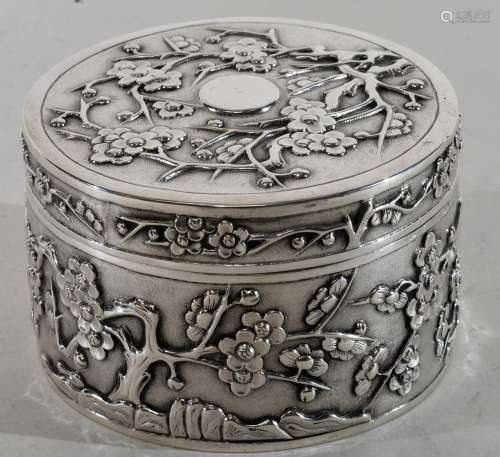 Chinese Export silver box. 19th to early 20th century. Cylindrical form. Decoration of flowering prunus on a fish roe ground. Signed W.H.  3-1/4