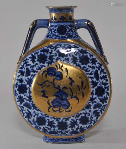Porcelain vase. China. 19th century. Tao Kuang mark. Moon flask form. Underglaze blue decoration of peaches, bats and floral scroll. Later gilt decoration. 10