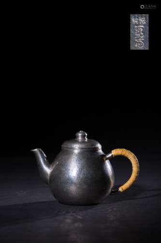 A SILVER TEAPOT WITH MARKING