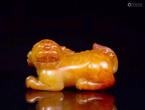 A HETIAN JADE CARVED LION SHAPED PENDANT