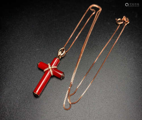 AN AKA RED CORAL PENDANT WITH 18K GOLD NECKLACE