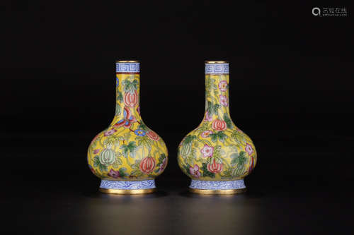 A PAIR OF YELLOW GLAZE WITH ENAMELED FLORAL PATTERN VASES