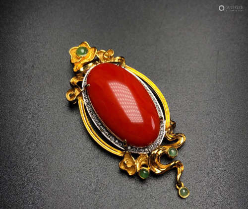 A MOMO CORAL WITH GOLD PENDANT