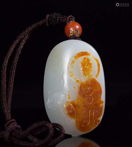 A HETIAN JADE PENDANT WITH RED SKIN FIGURE CARVING