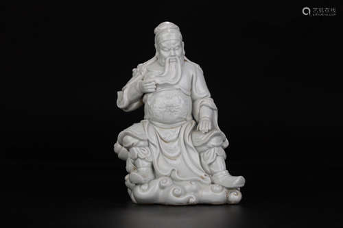 A WHITE GLAZE FIGURE OF GUANYU