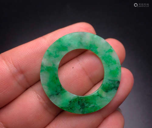 A JADEITE PENDANT SHAPED CIRCLE