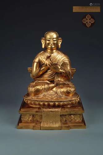 A GILT-BRONZE FIGURE OF LAMA, YONGLE MARK