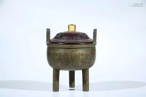 A BRONZE ARCHAISTIC TRIPOD CENSER