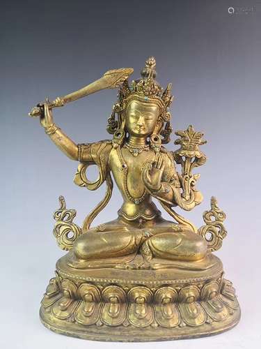 A GILT-BRONZE FIGURE OF TARA