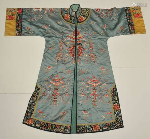 Woman's silk robe. China. 19th century. Teal blue ground with embroidery of lanterns. Slight toning.