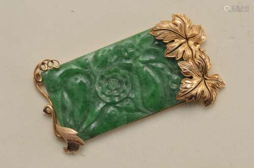 Carved Jade pendant set in 18 k yellow gold frame. Jade is rectangular, measuring approximately 37 x 25 mm, total weight of 9.1 grams. Hallmarked 750.   1-3/4