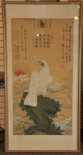 Scroll painting. China. 19th century. Ink and colours on silk. White gyrfalcon and a rocky outcrop at sun rise above the sea. Extensive inscriptions and eight seals. 45-1/2