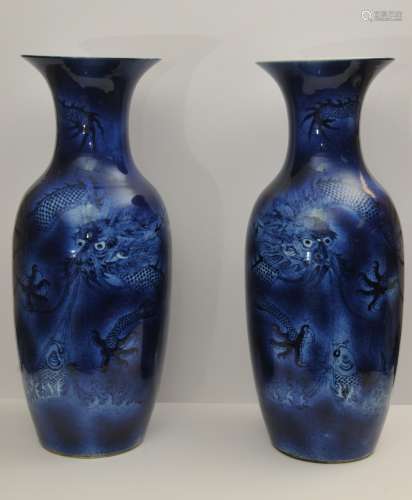 Pair of porcelain vases. China. 19th to early 20th century. Baluster form. Cobalt blue with dragons. 23