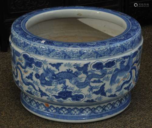 Porcelain brazier. Japan. Meiji period. (1868-1912). Underglaze blue  decoration of dragons and clouds. Signed with a seal along lower rim. 22