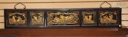 Rosewood wall plaque. China. 19th century. Surfaces carved with historical figures. Decoration of red and gold lacquer inset with mother of pearl.  50