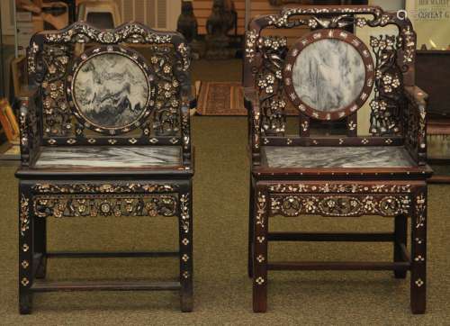 Similar pair of armchairs. China. 19th C. Rosewood carved in archaic patterns. Inlay of Mother of Pearl, inset with dreamstone marble plaques.
