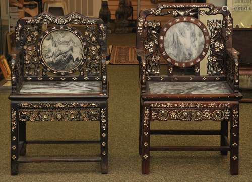 Similar pair of armchairs. China. 19th C. Rosewood carved in archaic patterns. Inlay of Mother of Pearl, inset with dreamstone marble plaques.