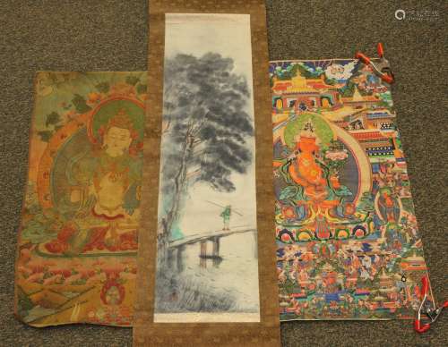 Lot of three items. To include: a Japanese scroll and two thangkhas, one woven, the printed on paper.