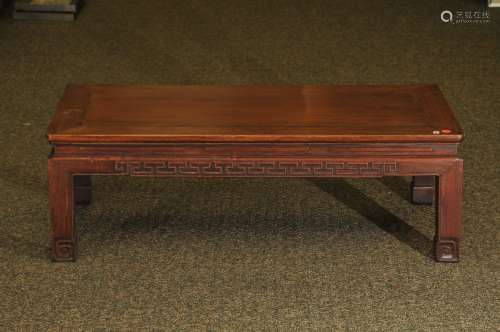 K'ang table. China. 19th century. Rectangular form. Aprons carved with archaic scrolling. Rosewood. 37