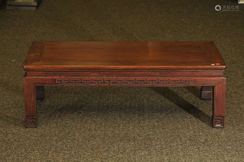 K'ang table. China. 19th century. Rectangular form. Aprons carved with archaic scrolling. Rosewood. 37