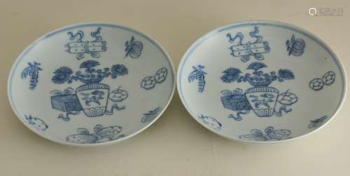 Pair of early 19th century Chinese blue and white porcelain dishes with underglaze blue Antiquities decoration. Jiaging marks on bases. Both with repaired rims. 6