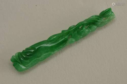 Carved Jadeite elongated pendant. 42.3 x 7.5 mm. 1.7 grams. With 