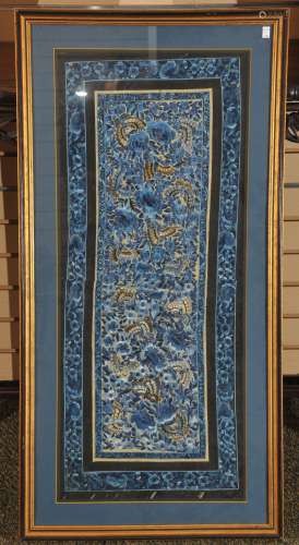 Textile panel. China. 19th century. Blue silk embroidered with flowers and butterflies. 33