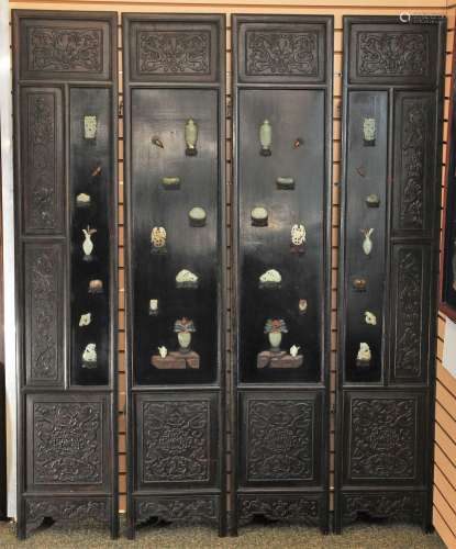19th/20th century Chinese four panel carved Rosewood floor screen with jade and hardstone mounted vase forms and mythiological animals. Floral scroll lacquer decorated back panels. Spike and loop hinges. Each panel- 72-1/2