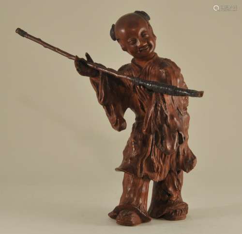 Burlwood carving. China. 19th century. Standing figure of an Immortal. 7-3/4