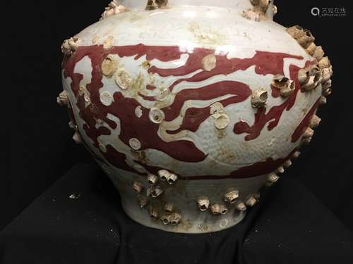 A White Glaze and Iron Red Porcelain Jar