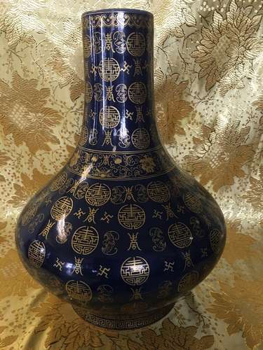 A Blue Glaze and Gilt-Decorated Porcelain Vase