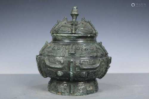 A Bronze Ritual Wine Vessel and Cover