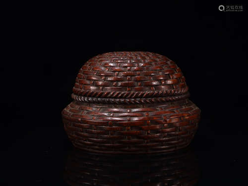 A BAMBOO VESSEL WITH PATTERNS