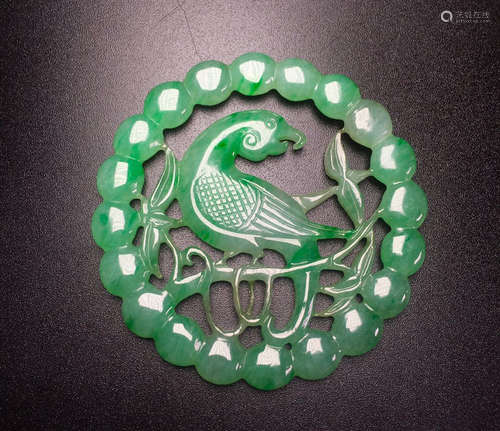 A CIRCLE JADEITE PENDANT WITH MAGPIE PATTERN