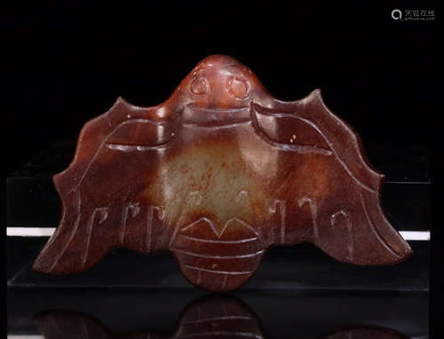 A HETIAN JADE ORNAMENT OF FLYING BEAST