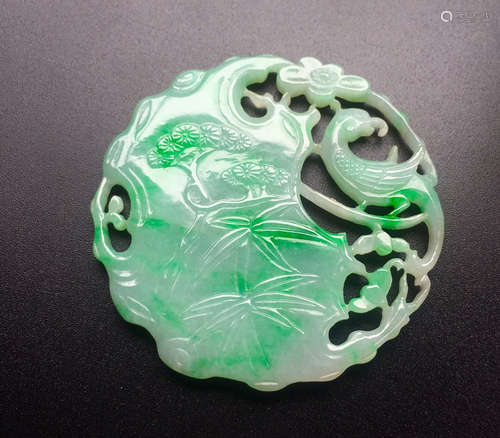 A WAXY JADEITE PENDANT WITH POETRY PATTERN