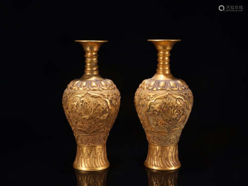 A PAIR OF GILT BRONZE VASES WITH FLOWER PATTERNS
