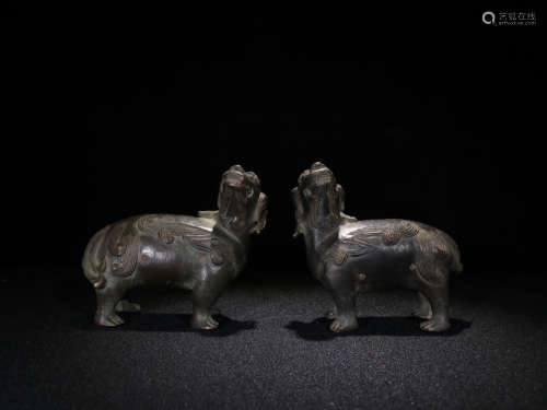 A PAIR OF BRONZE BEAST ORNAMENTS