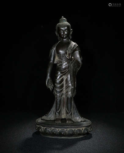 A BRONZE BUDDHA STANDING FIGURE