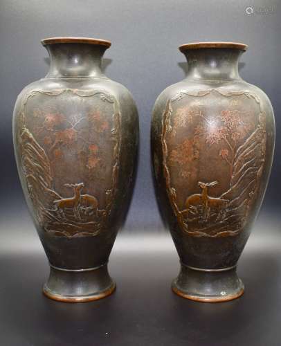 An interesting pair of Japanese bronze deer vases- 19th century