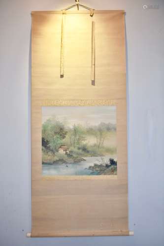 A Chinese scroll painting of a landscape scene