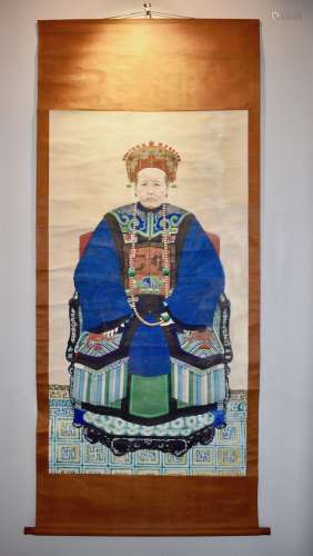 A Chinese scroll painting portrait of a Chinese elder woman official.