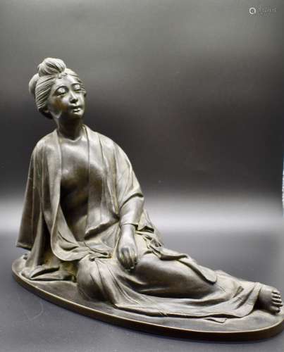 A large Japanese Bronze figure of a reclining woman- 19th century