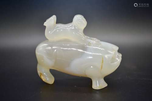 A Chinese agate stone figure of a man riding a three-legged toad- 19th century