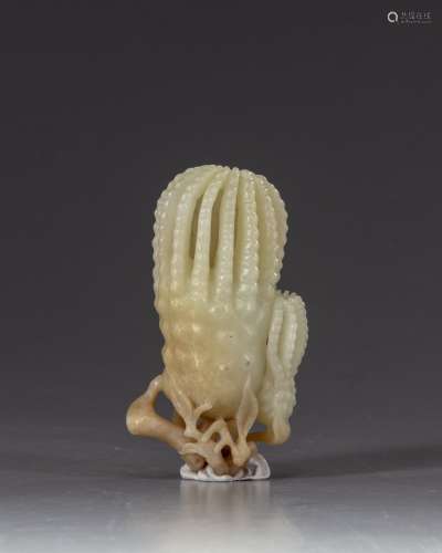 A Chinese pale celadon jade 'finger citron' carving