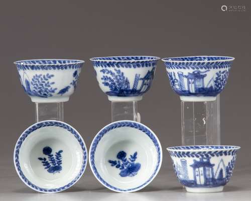 six blue and white cups