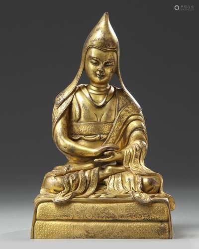 A Chinese gilt bronze figure of a Lama