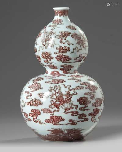 A Chinese underglaze red decorated double gourd vase